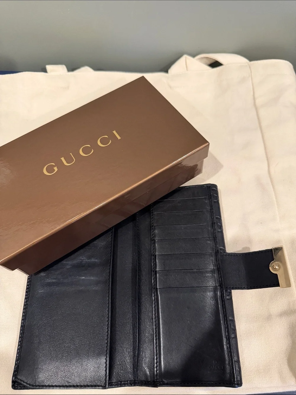 Gucci Black Embossed GG Leather Continental Wallet with Gold Accent
